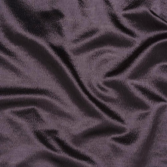 Crumpled aubergine plum fabric with a soft woven sheen and dark shadowed folds