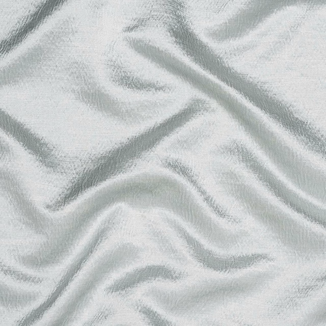 Pale eggshell fabric with a soft woven texture and gentle sheen, draped in folds