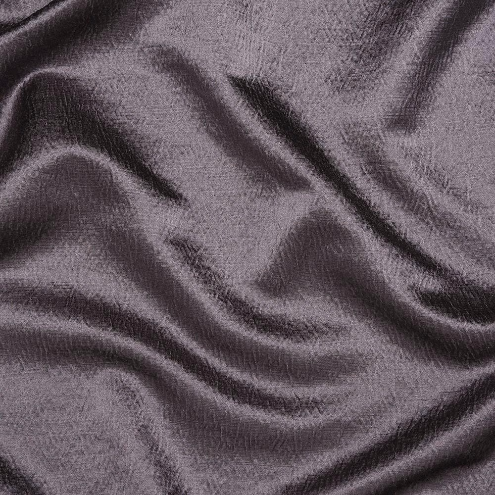 Close-up of dusty mauve fabric with subtle sheen and soft rippled texture