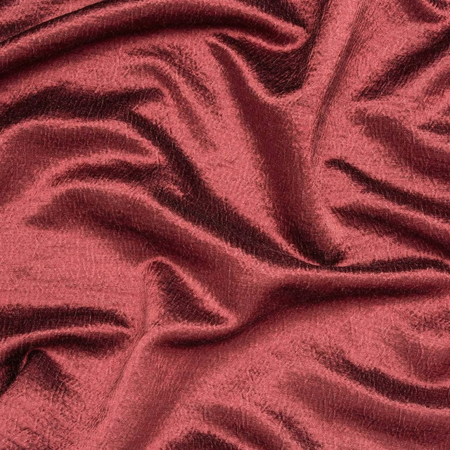 Deep mulberry velvet-look fabric with soft sheen and gathered folds