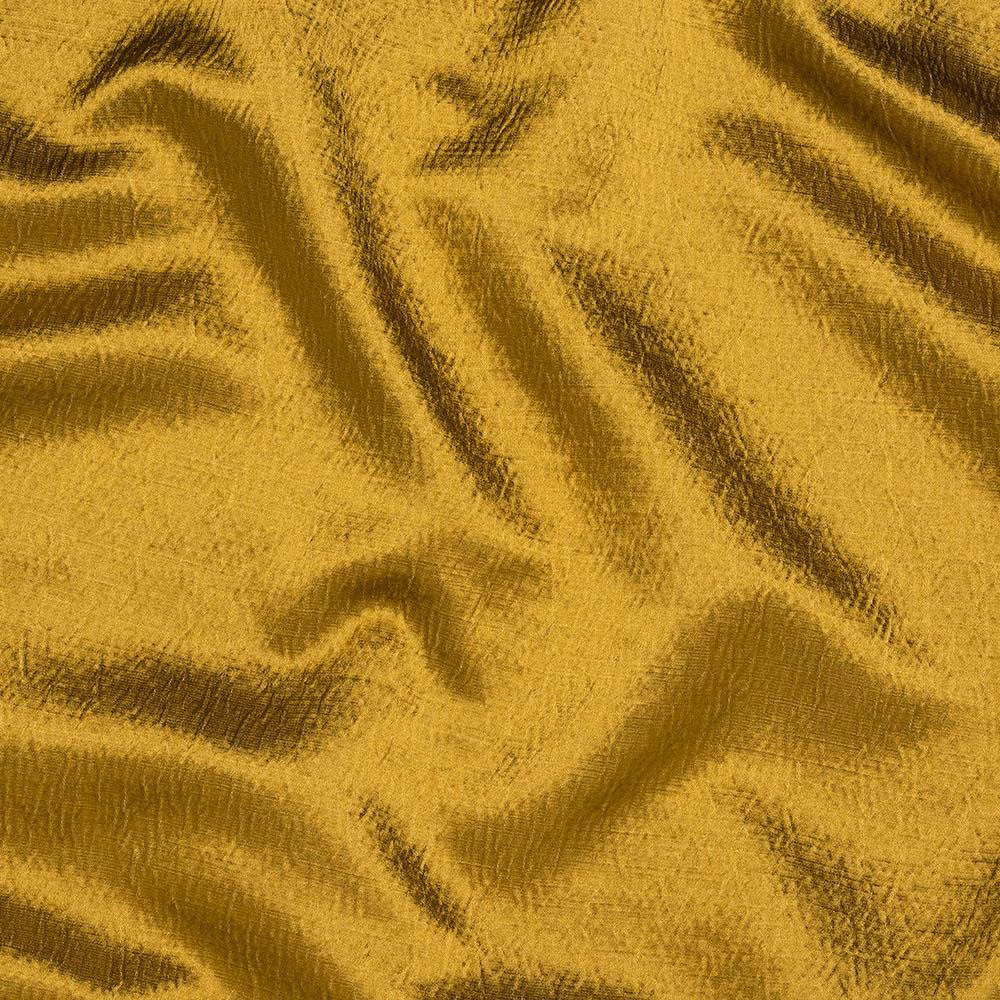 Ochre gold fabric with soft sheen and fluid folds