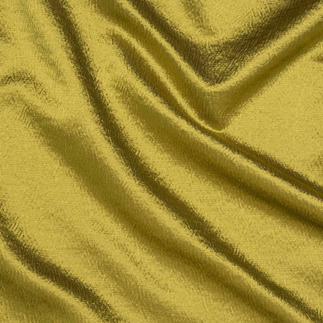 Muted olive yellow plain woven fabric with soft sheen and draped folds