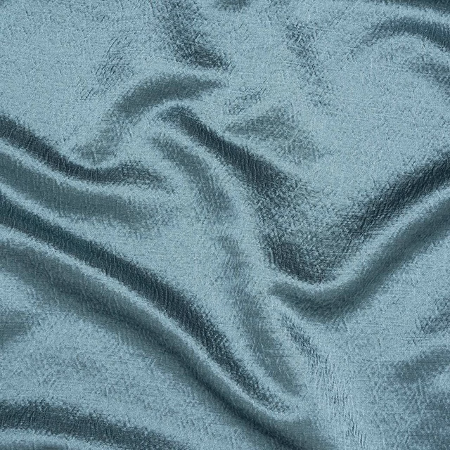 Soft seafoam teal plain fabric with a gently lustrous, rippled surface