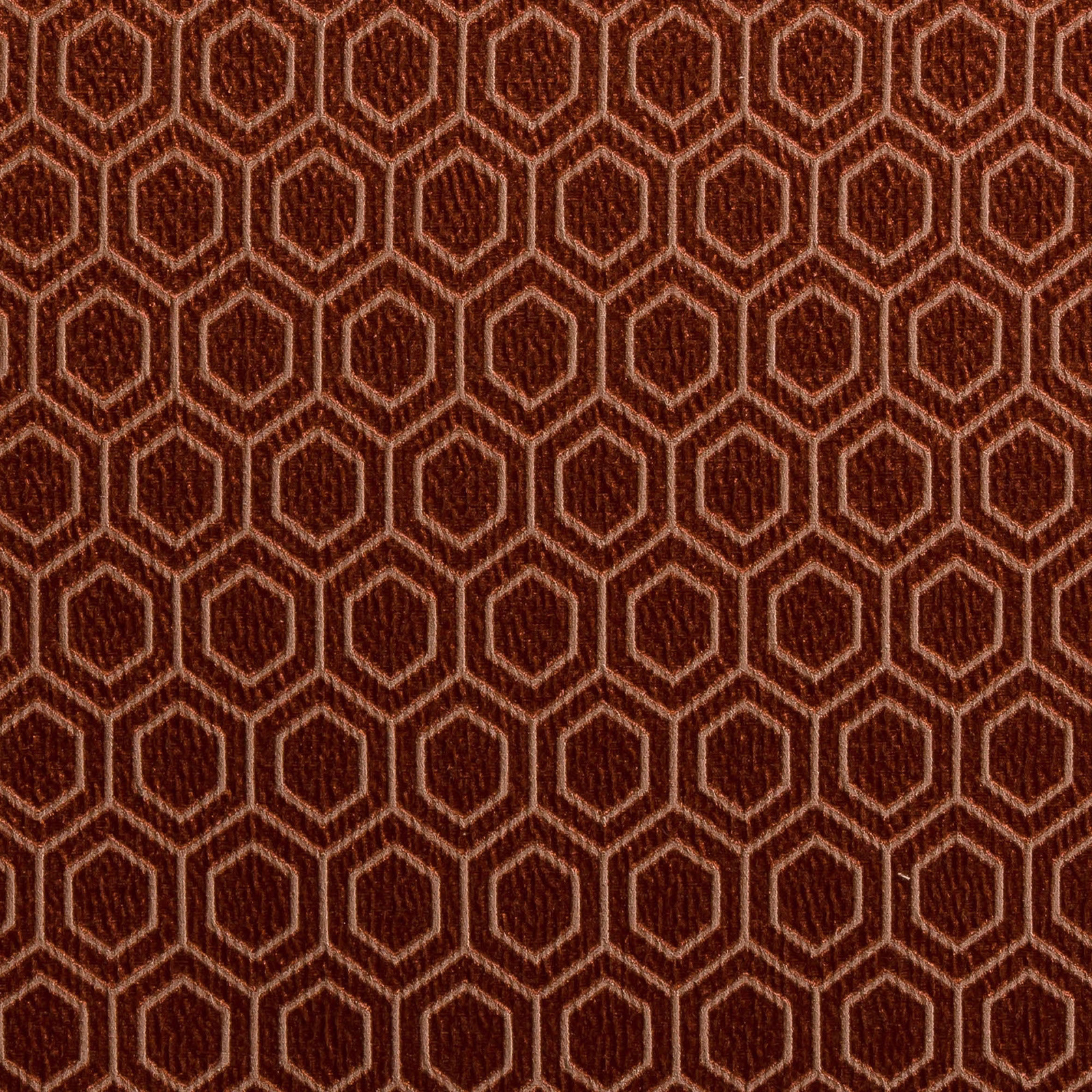 Close-up of burnished bronze hexagon weave with copper outlines on a dark ground