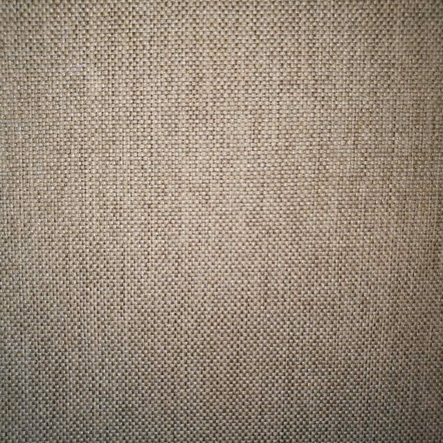 Close-up of soft beige woven fabric with fine basket texture