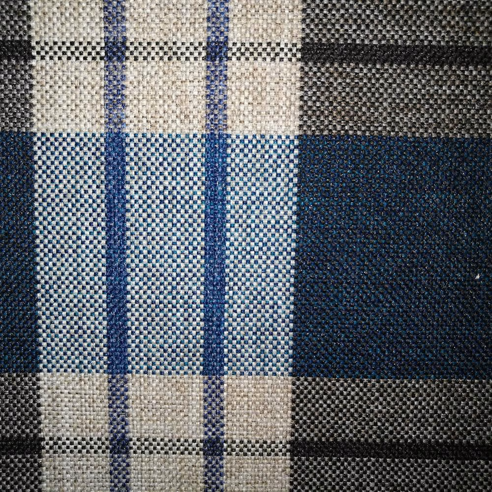 Textured woven check fabric in deep teal, navy, cream and charcoal blocks