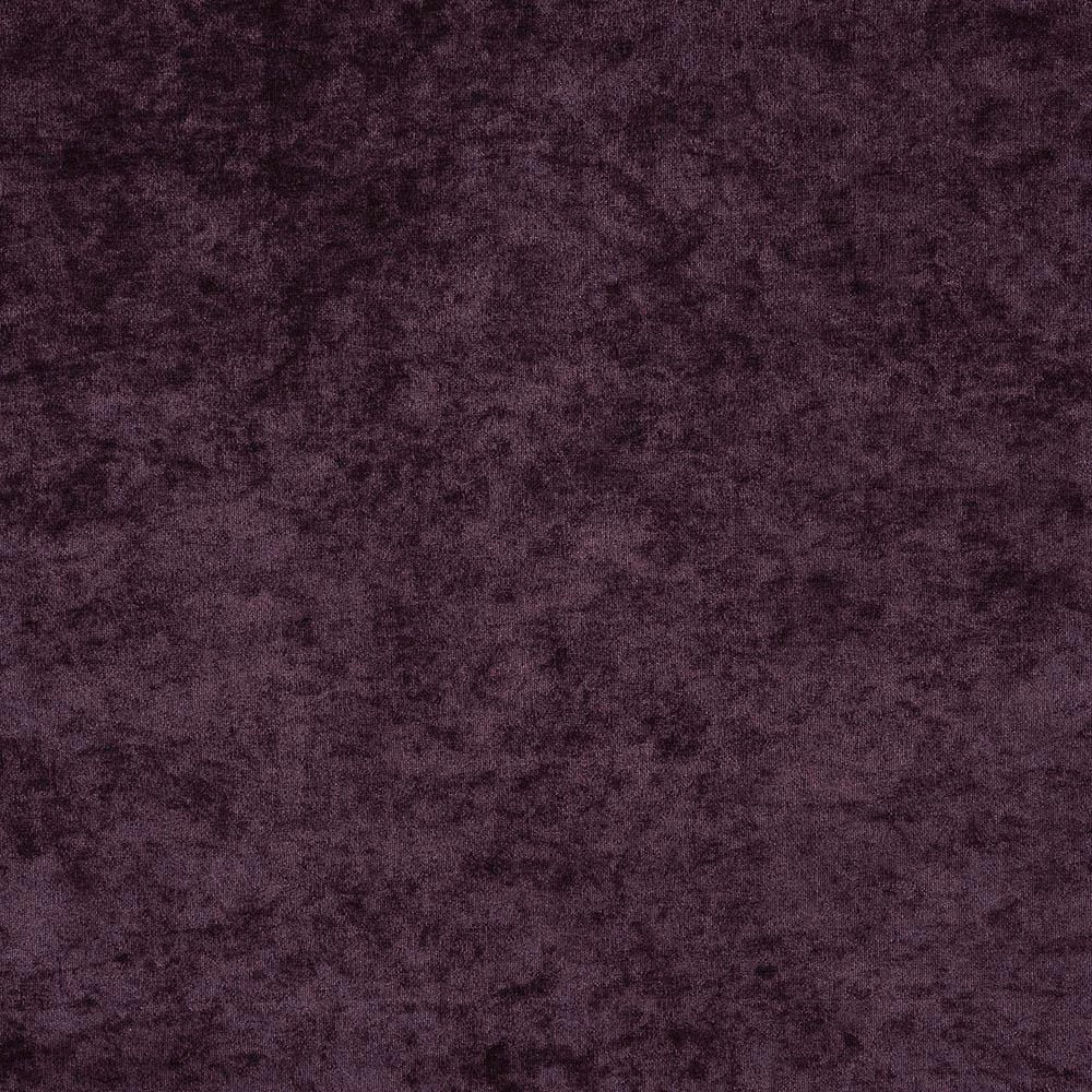 Close-up of deep aubergine purple fabric with a soft mottled, velvety texture