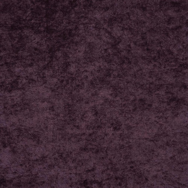 Close-up of deep aubergine purple fabric with a soft mottled, velvety texture
