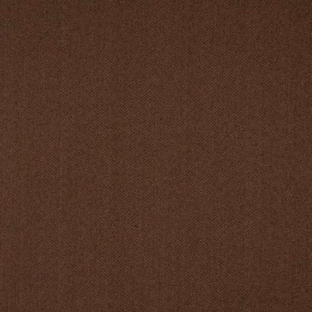 Close-up of deep cocoa brown animal-pattern fabric with a fine woven texture