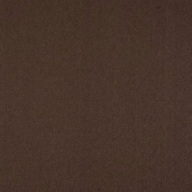 Close-up of deep cocoa brown animal-pattern fabric with a fine textured weave
