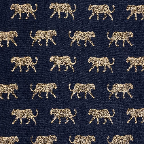 Dark indigo fabric with small gold leopard motifs and a visible woven texture.