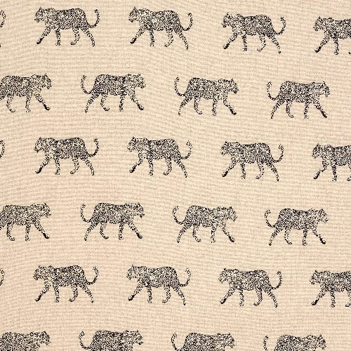 Warm cream cotton fabric with small dark leopard motifs in neat rows