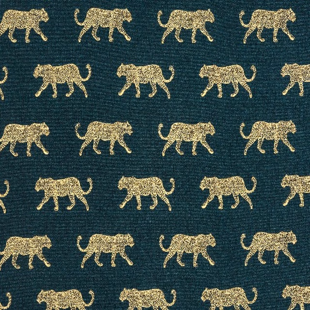 Teal woven cotton fabric with repeating gold leopard motif