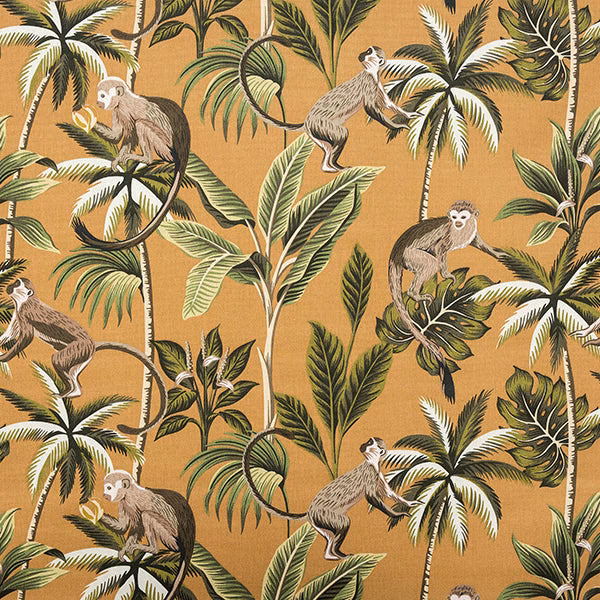 Ochre cotton fabric printed with monkeys and tropical foliage