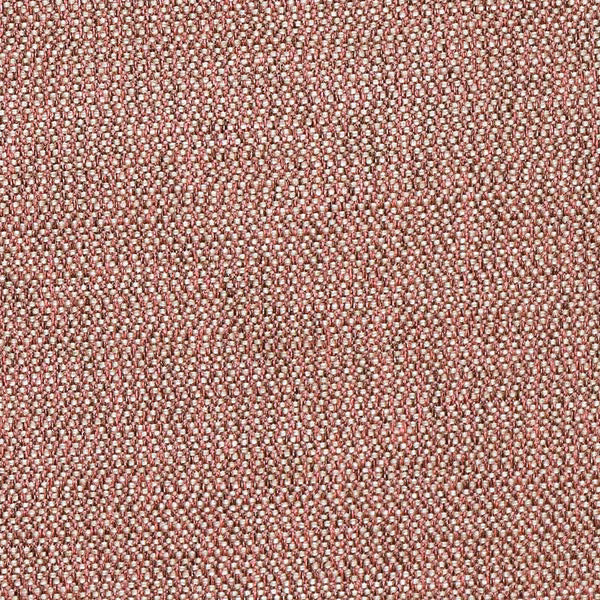 Close-up of a dusty coral pink woven fabric with tiny cream flecks