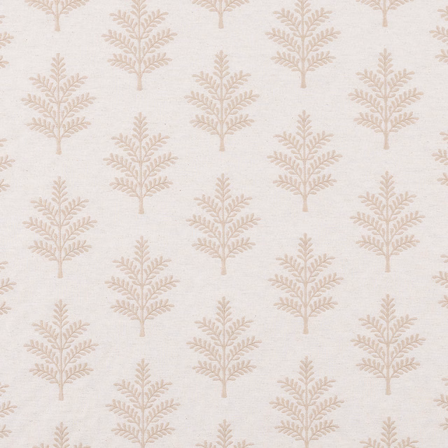 Pale cream fabric with repeating delicate leaf tree motifs on an ivory ground