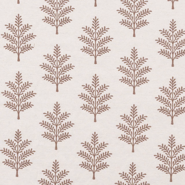 Pale ivory fabric with small taupe tree motifs in an even repeating pattern