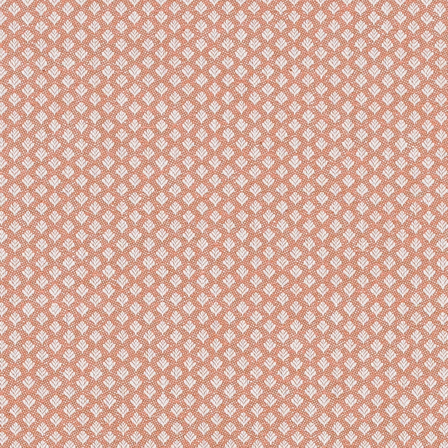 Small repeating pale motif on burnt orange woven fabric swatch