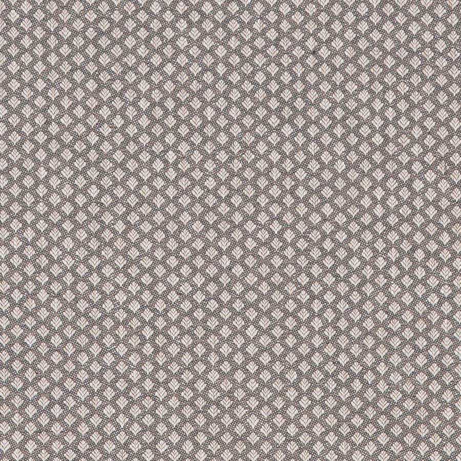 Close-up of small charcoal grey geometric woven fabric with pale motif accents