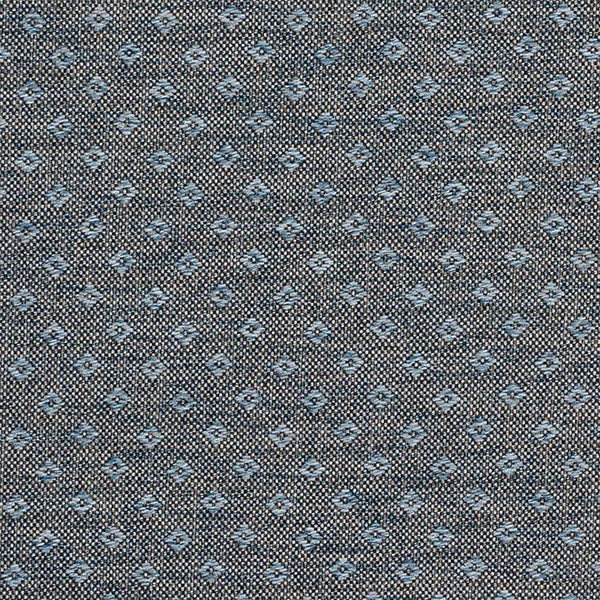 Small blue geometric motif on a dark grey textured woven fabric