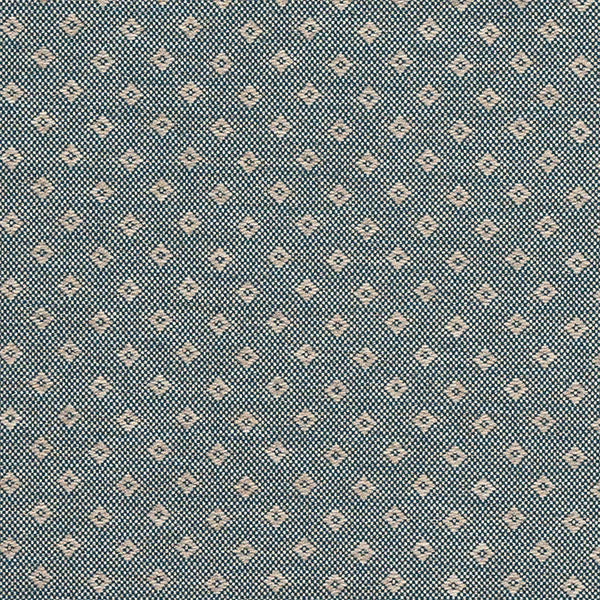 Small geometric fabric swatch in muted teal with cream diamond motifs