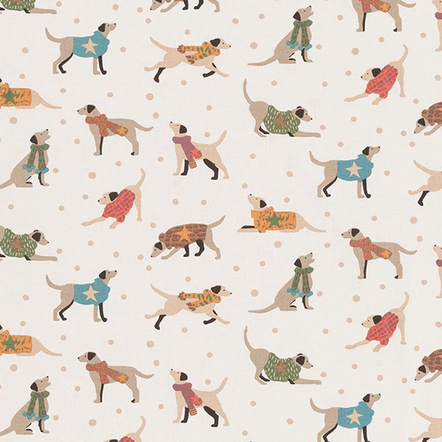 Scattered dog print on warm cream cotton ground with small polka dots
