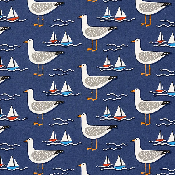 Navy cotton fabric with gulls, sailboats and waves in a coastal print