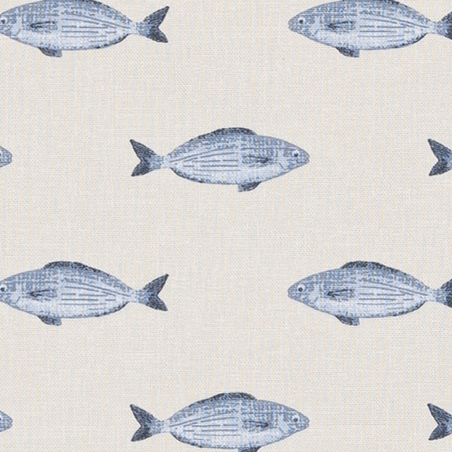 Blue fish motif printed on an ivory cotton fabric swatch