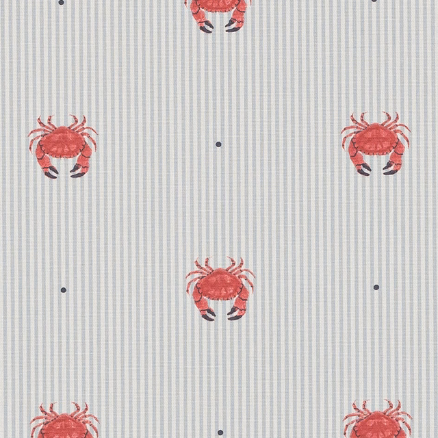 Coral-red crab motif on a pale striped cotton fabric