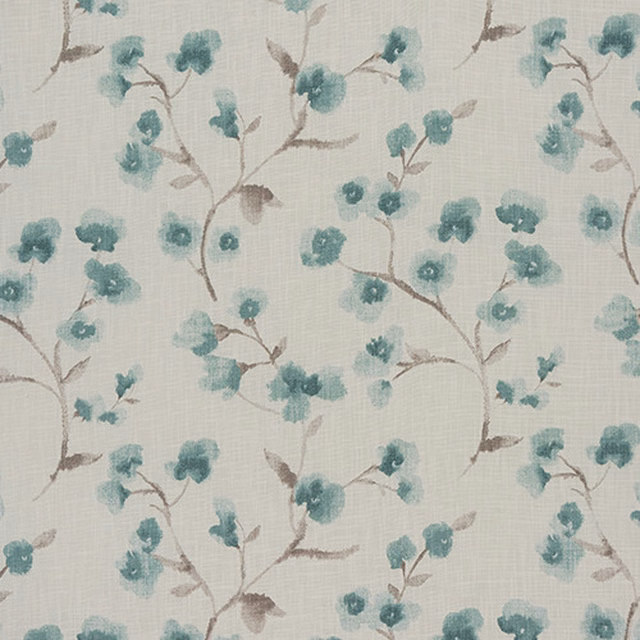 Cream cotton fabric with small cornflower blue floral trail and brown-grey stems