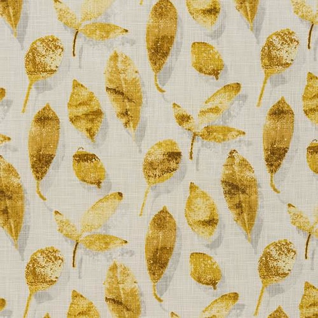 Ochre leaf-print cotton swatch on a pale textured ground