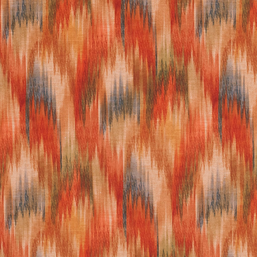 Abstract terracotta and coral zigzag print with muted blue-grey accents on woven fabric