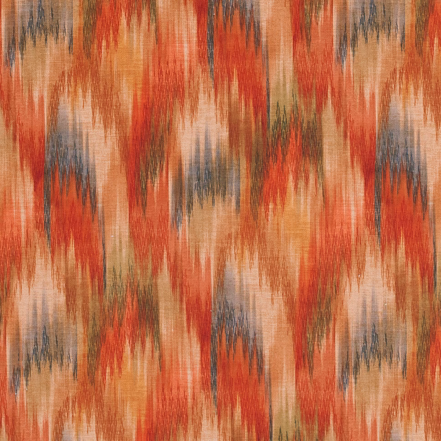 Abstract terracotta and coral zigzag print with muted blue-grey accents on woven fabric