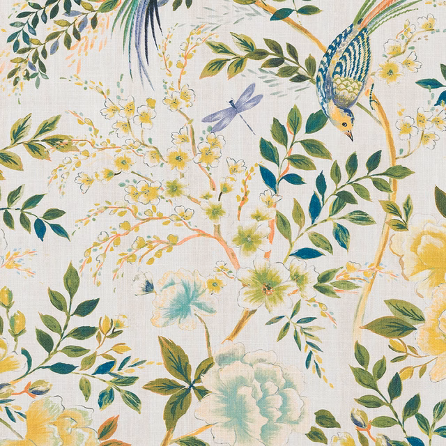 Printed cotton swatch with ochre, green and teal botanical leaves on a pale ground