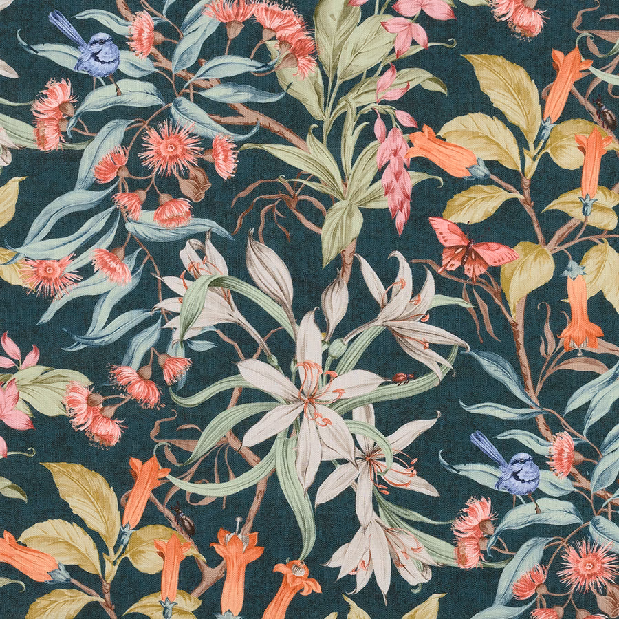 Botanical cotton print on a deep teal ground with coral, cream and green flowers