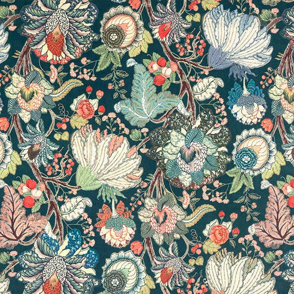 Large-scale floral print on deep jade green ground with cream, aqua and coral blossoms