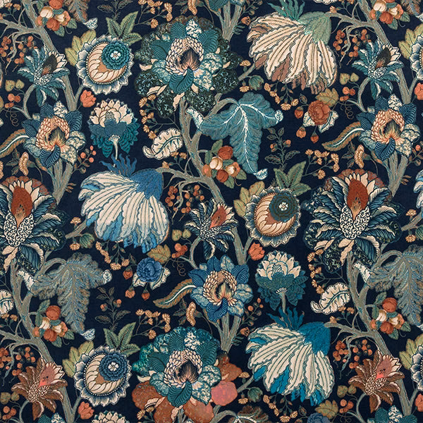 Dense floral print on navy ground with teal, cream and rust blossoms