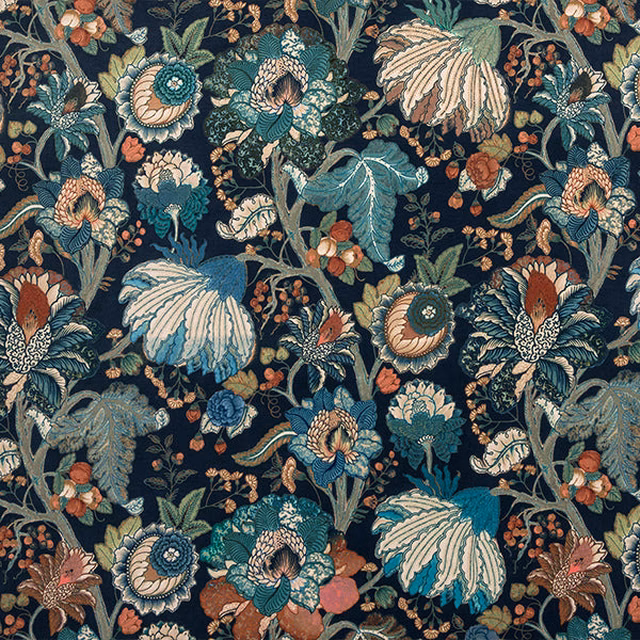 Dense floral print on navy ground with teal, cream and rust blossoms