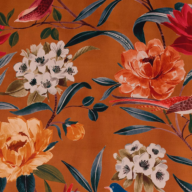 Large tropical floral print on burnt amber fabric with teal leaves and coral blossoms