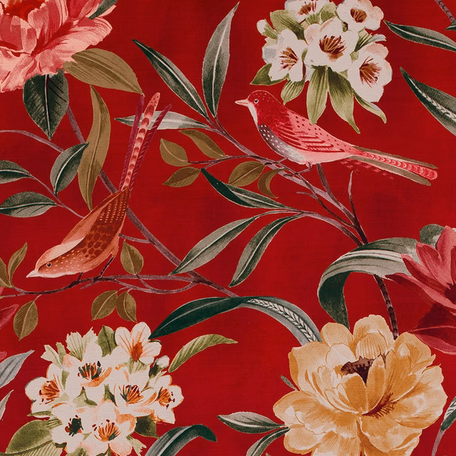 Red botanical fabric with birds, cream flowers and green leaves on a bright scarlet ground