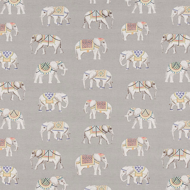 Soft dove grey cotton fabric with small printed elephants in pastel trappings