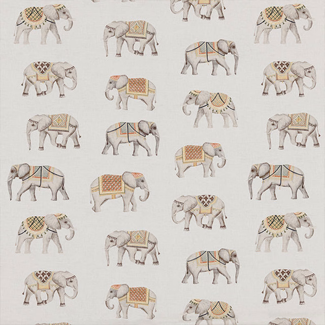 Scattered pale elephants printed on a soft ivory cotton ground