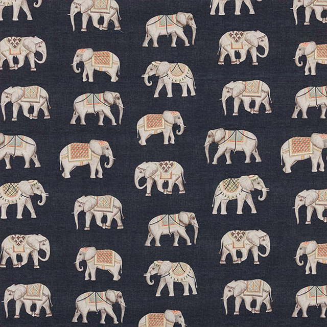 Patterned cotton fabric with ivory elephants on a deep navy ground