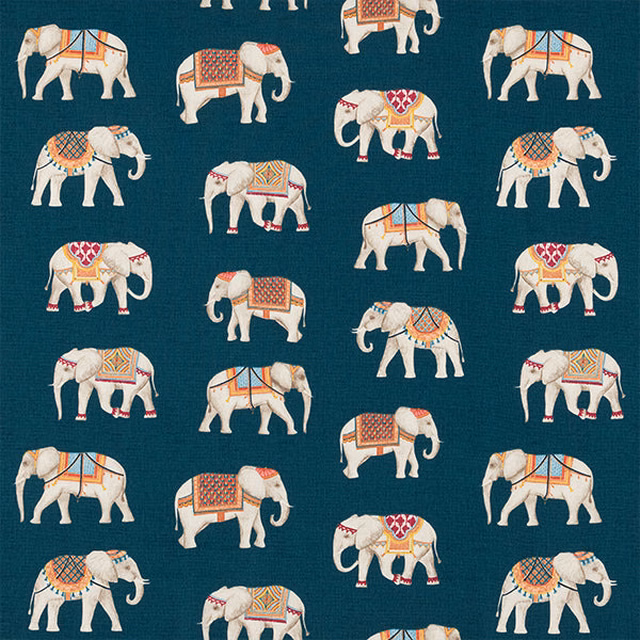 Teal cotton fabric with repeating cream elephant print and colourful saddle details