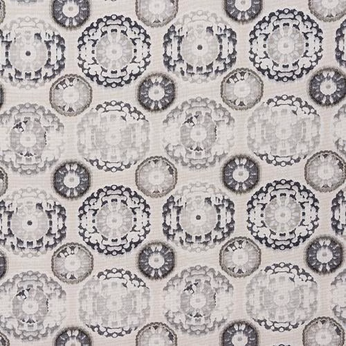 Grey circular medallion print on a pale woven fabric swatch