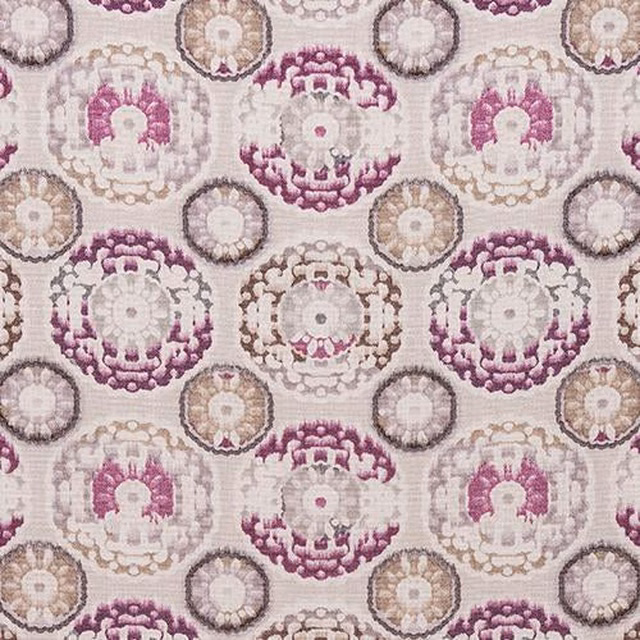 Swatch of Timor Heather showing circular medallion motifs in plum, mauve and beige on a cream ground