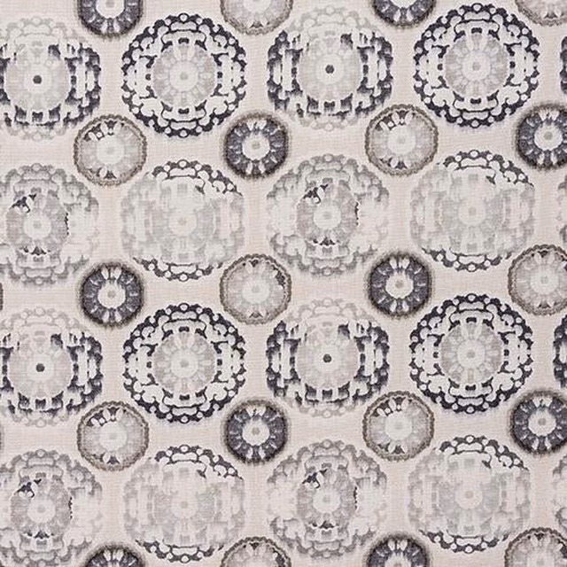Ochre fabric with large circular medallion print in cream, grey and charcoal