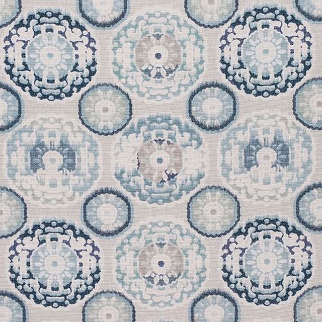 Printed fabric swatch with seafoam and teal circular medallions on a pale ground