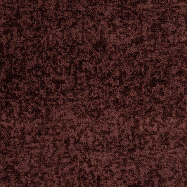 Mottled deep rose and plum fabric with a textured dark speckled surface