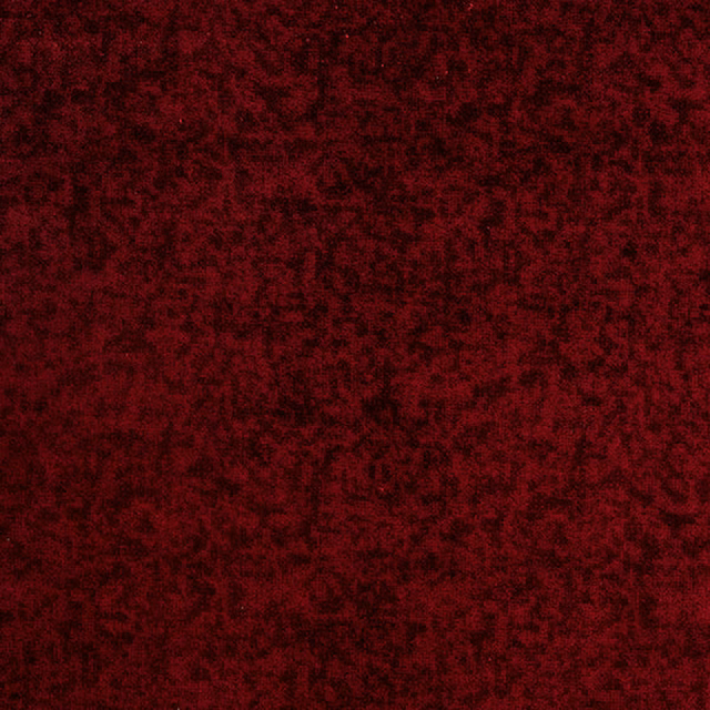 Deep ruby red velvety fabric with dark shadowed texture
